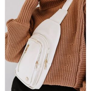 Cream colored sling bag